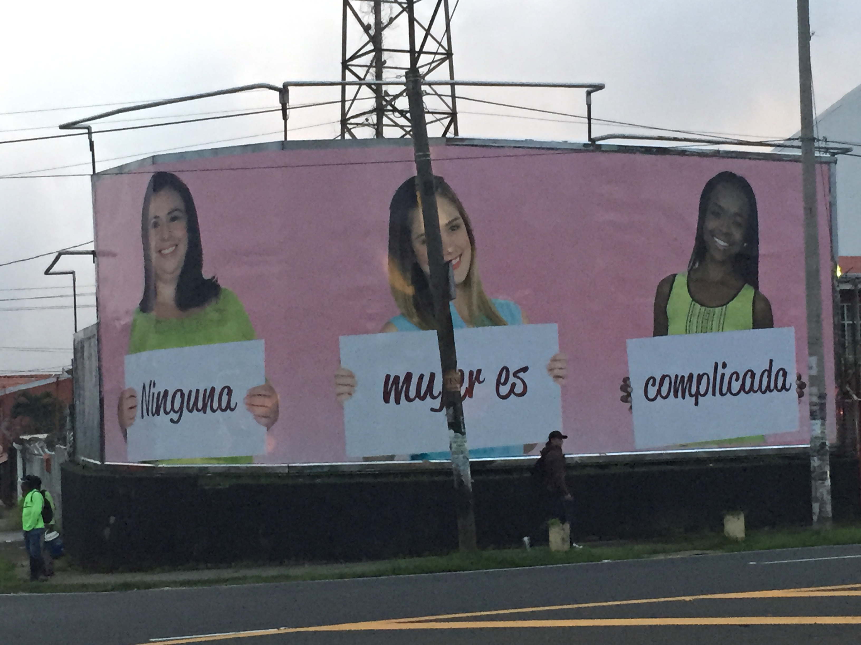 The giant billboard in front of my neighborhood which translates as "Nothing about Women is complicated." This is an advertisement for Banca Kristal. Does this ad challenge or perpetuate sexism? 