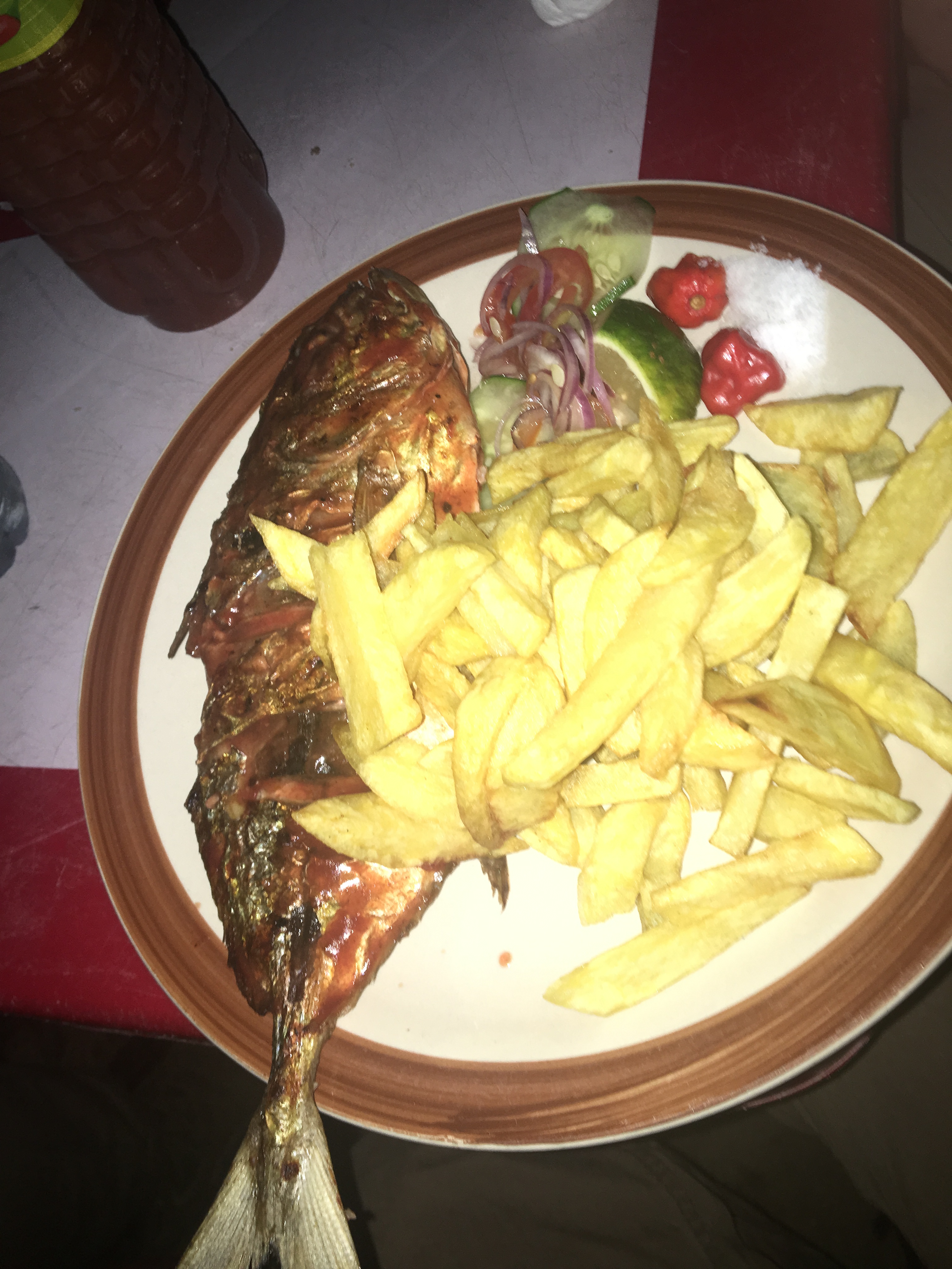 Grilled fish and chips at arestaurant on the coast of Dar es Salaam