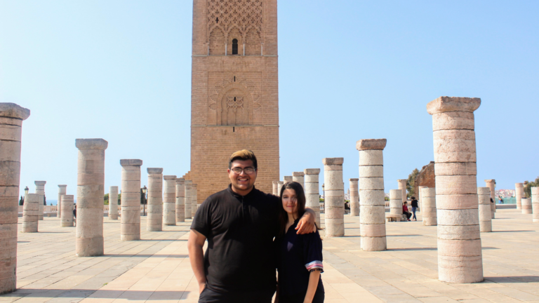 Steve Maravillo with friend Khaoula in front of columns