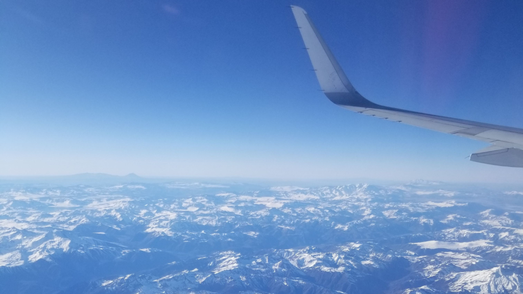 View of mountains from out of a plane window